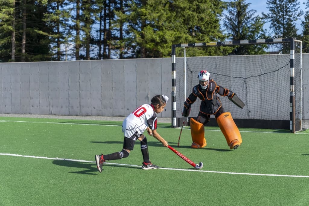 Striker taking a shot against goalkeeper