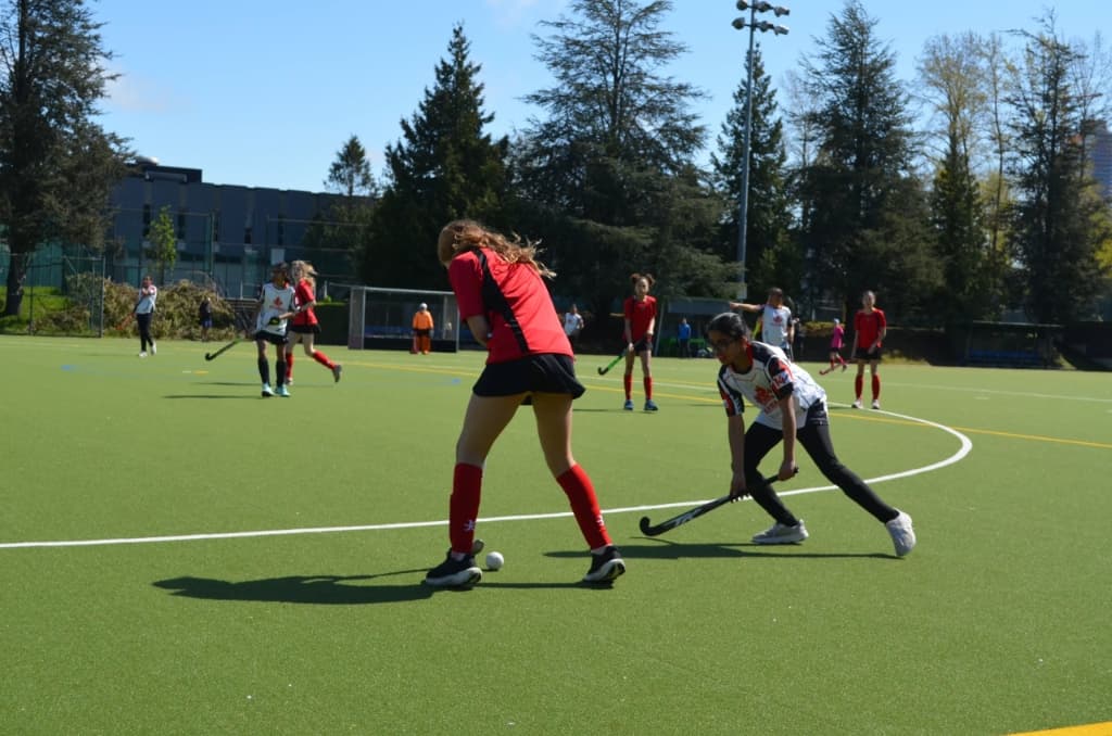 Player in red jersey in action on field